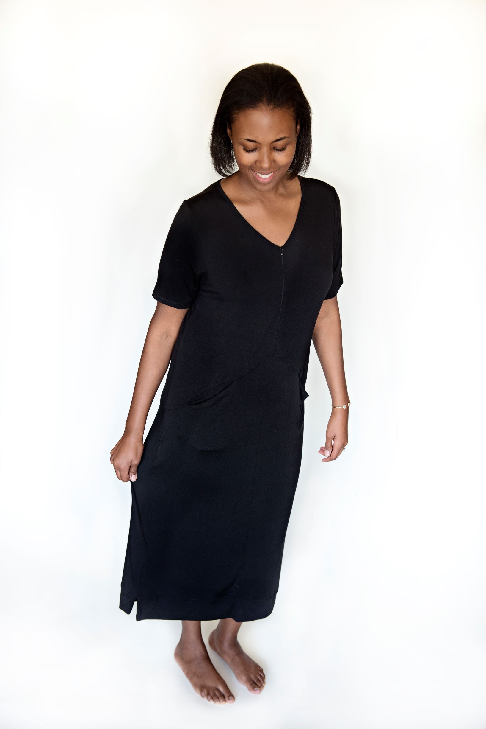 Black comfortable lounge dress made from micro modal and spandex. Pockets and deep zipper. 